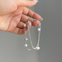 دستبند دولاین خاویاری مرواریدی طلایی و نقره ای